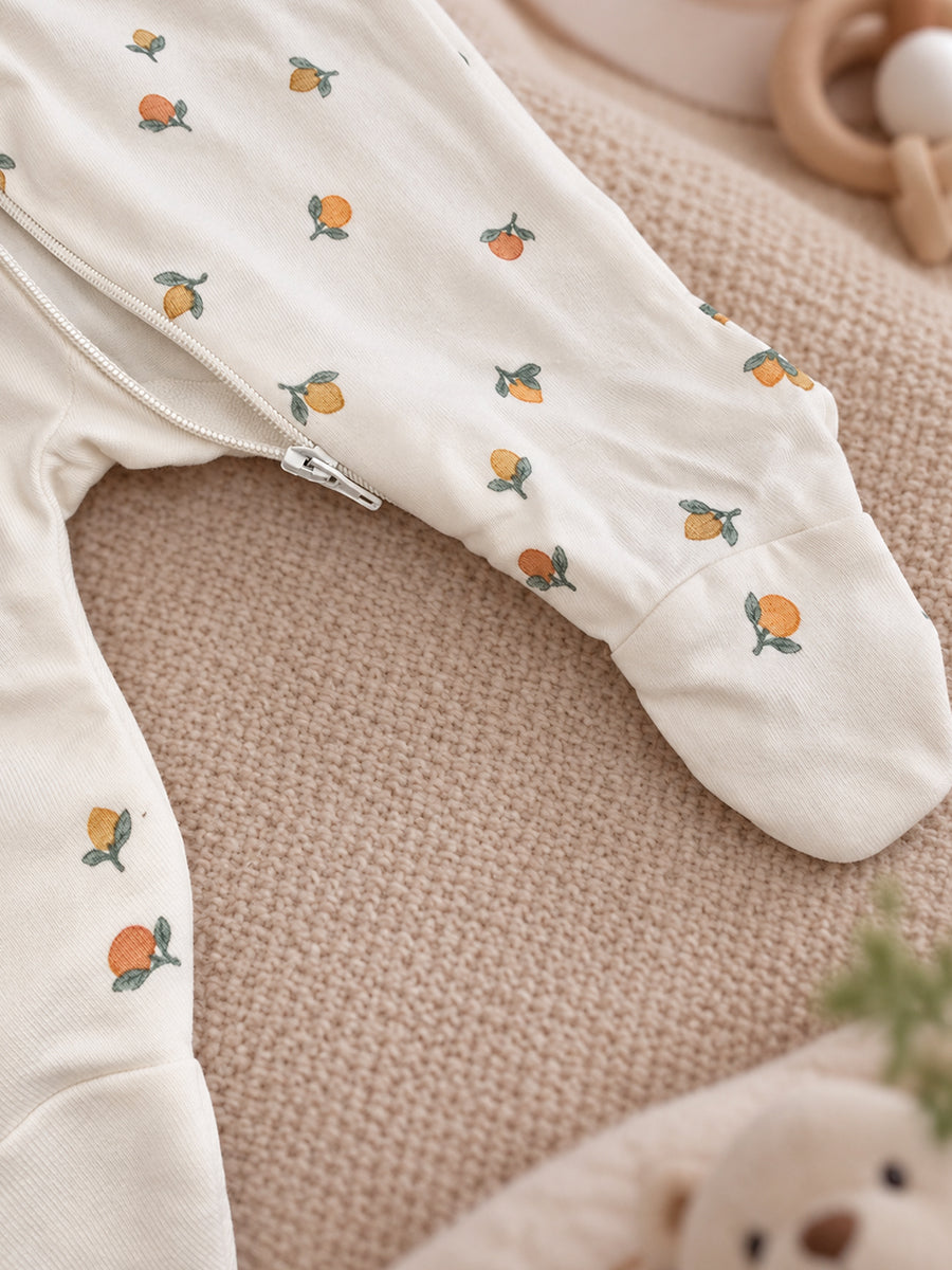 Ziva Baby Sleepsuit with Cap – Off White Tiny Orange Fruit Print | Premium Knitted Cotton | Front Zip | Fold-Over Mittens & Integrated Booties