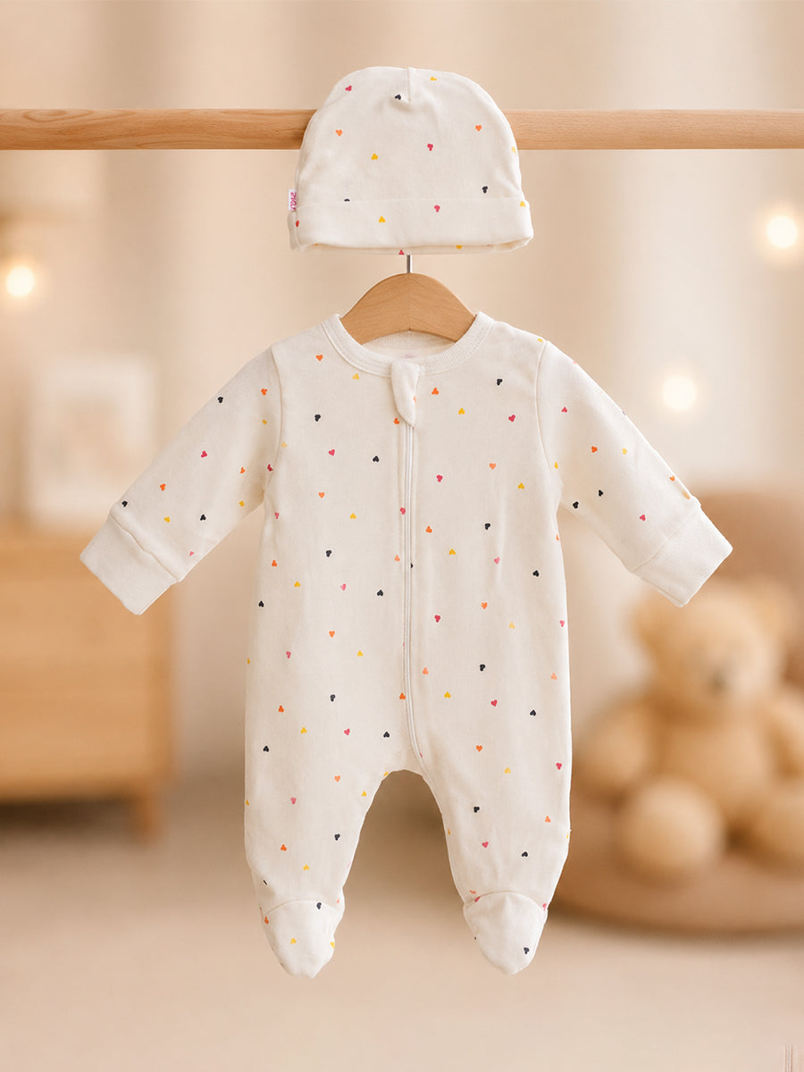 Ziva Knitted Cotton Baby Sleepsuit with Cap – Multicolor Mini Heart Print | Cream
