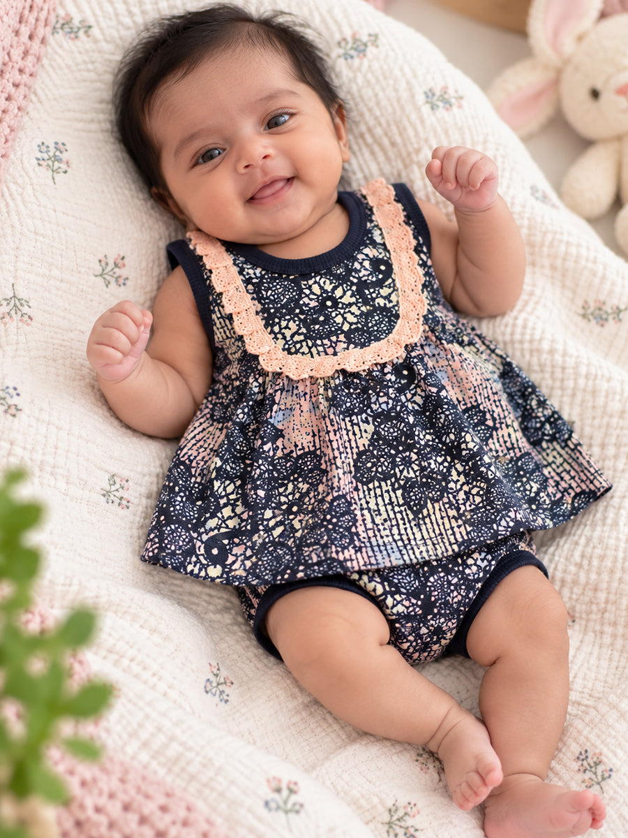 Ziva Baby Girl Frock with Pantie – Blush Peach & Navy Floral Lace Print | Premium Knitted Cotton | Lace Yoke | 2-Piece Set