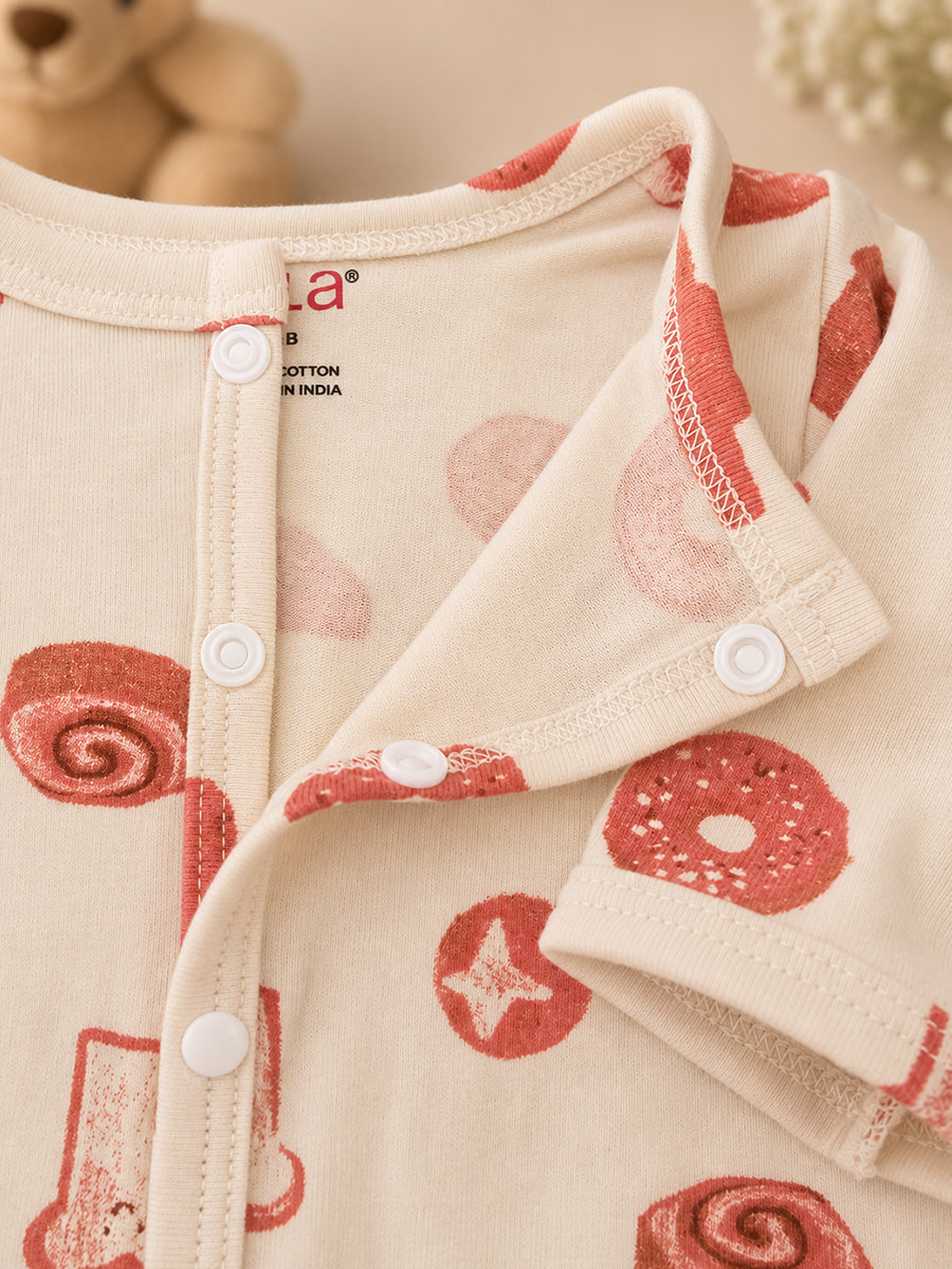 Ziva Baby Jumpsuit – Cream | Playful Bakery Print | Knitted Cotton | Front Open Snap Button