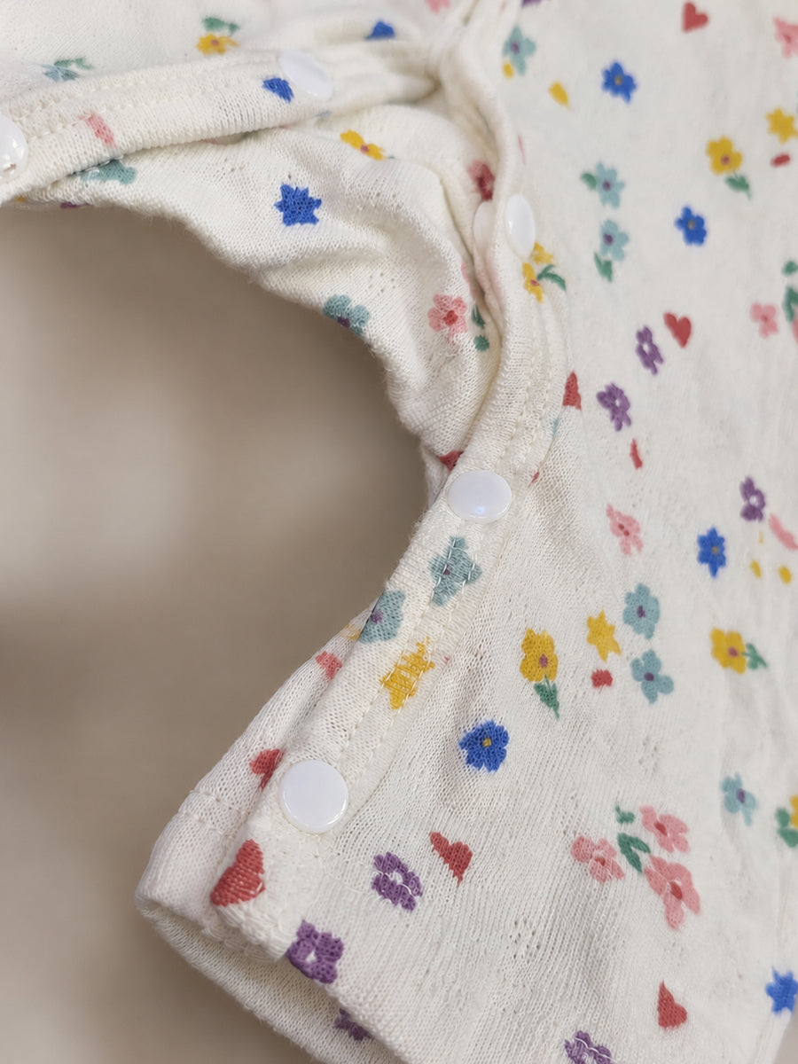 Ziva Baby Jumpsuit – Off White | Tiny Garden Hearts & Flowers Print | Premium Needle-Hole Knitted Cotton | Front Open Snap Button