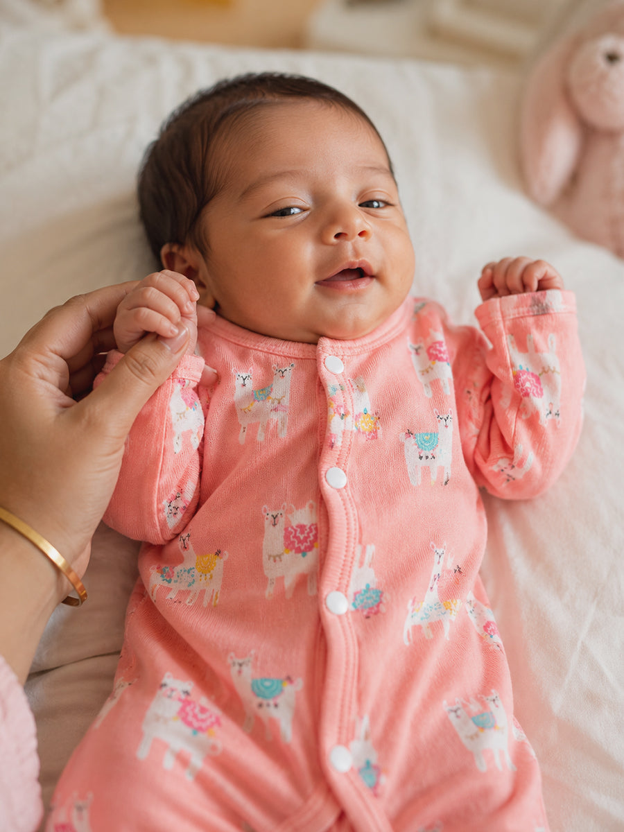 Ziva Baby Jumpsuit – Soft Peach Pink | Pastel Llama Parade Print | Knitted Cotton | Front Open Snap Button