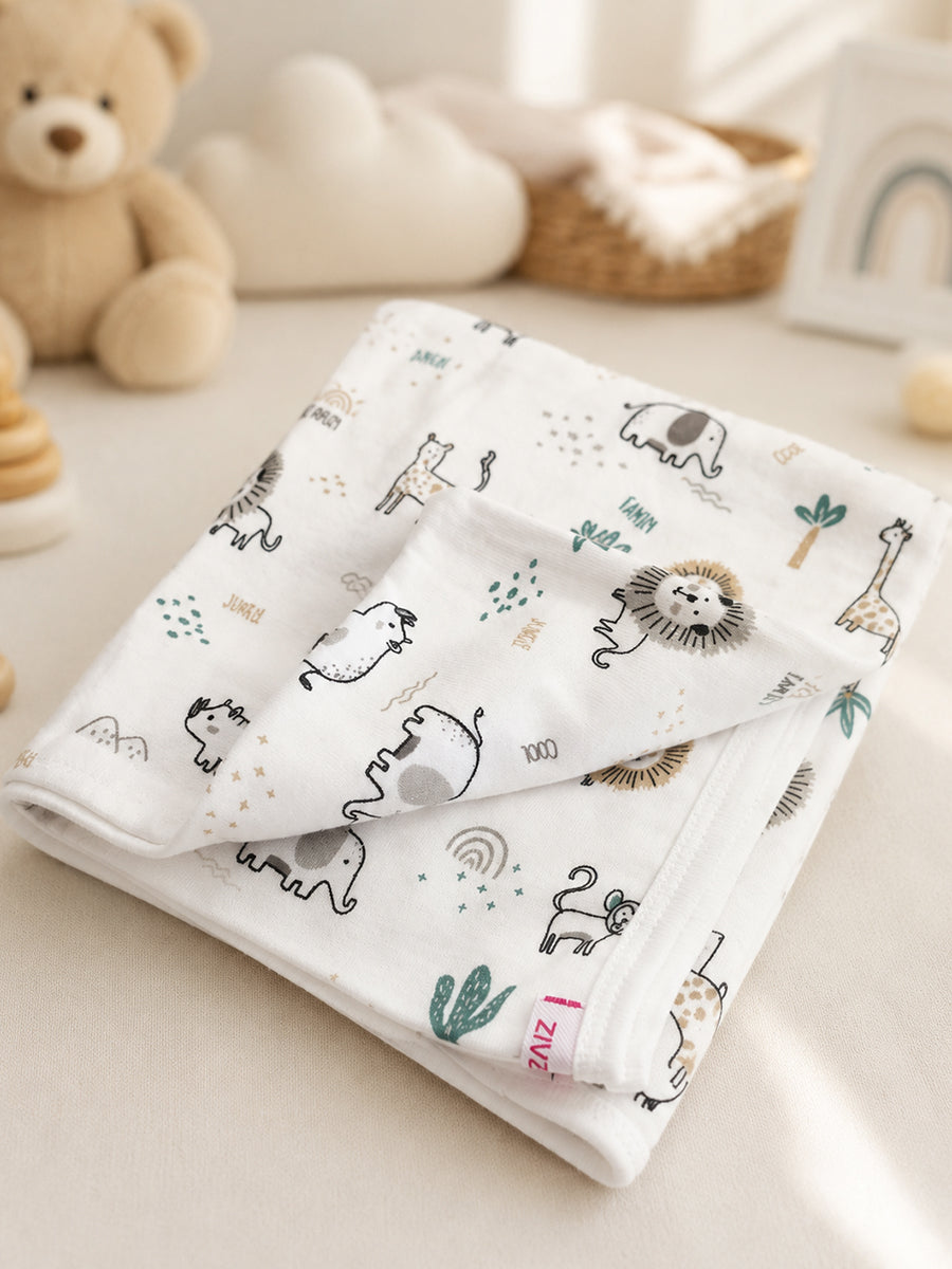 Ziva Baby Blanket – White | Tiny Safari Parade Print | Knitted Cotton
