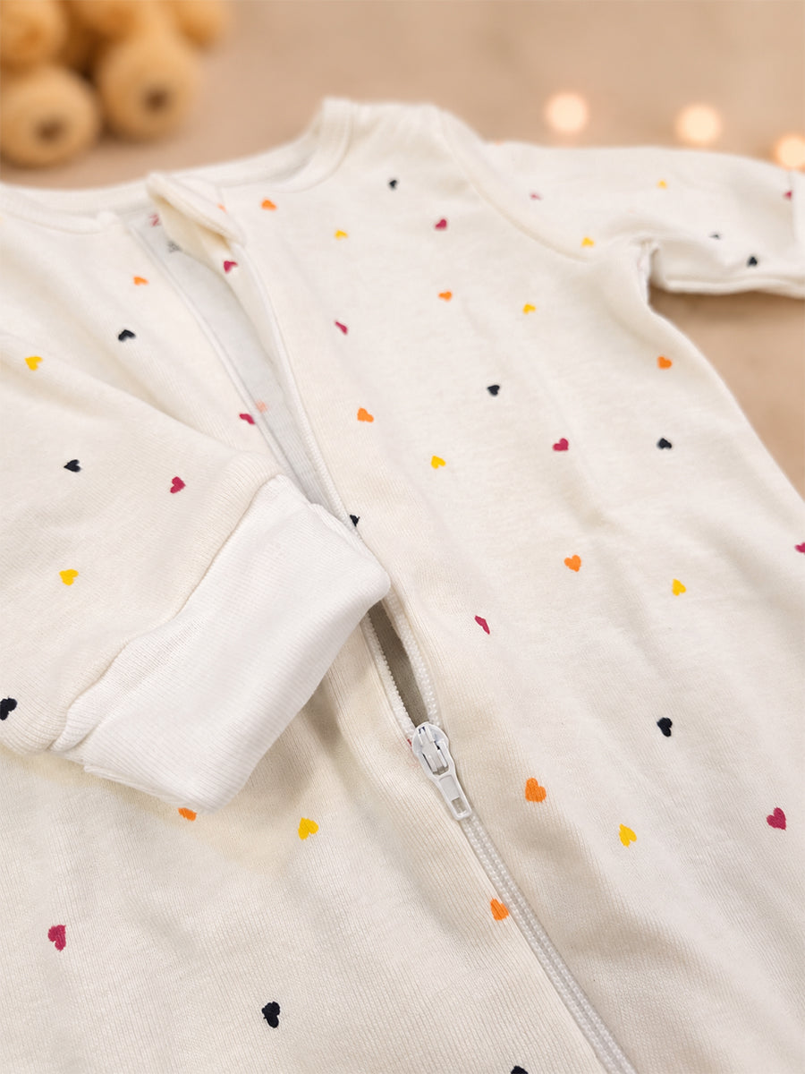 Ziva Knitted Cotton Baby Sleepsuit with Cap – Multicolor Mini Heart Print | Cream