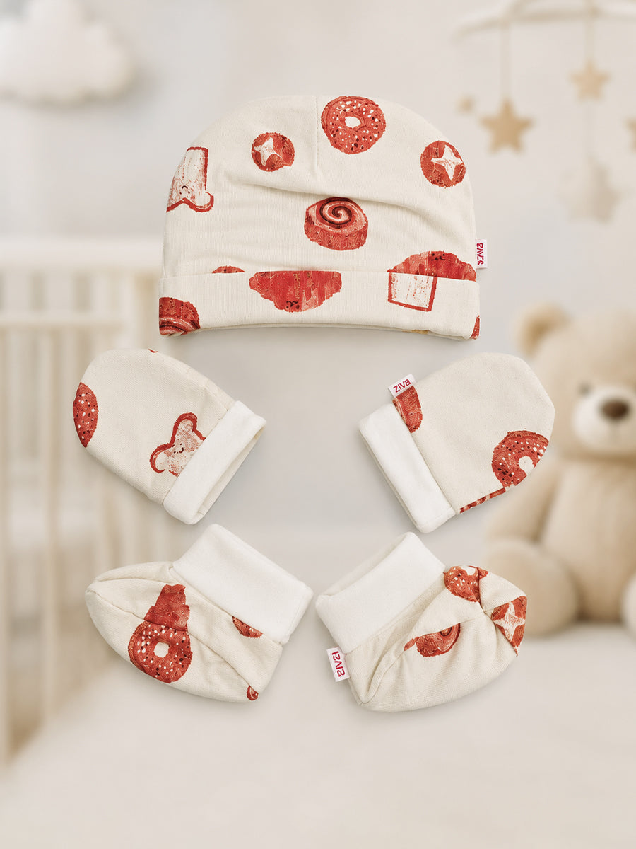 Ziva Baby Cap, Mitten & Bootie Set – Cream | Playful Bakery Print | Knitted Cotton