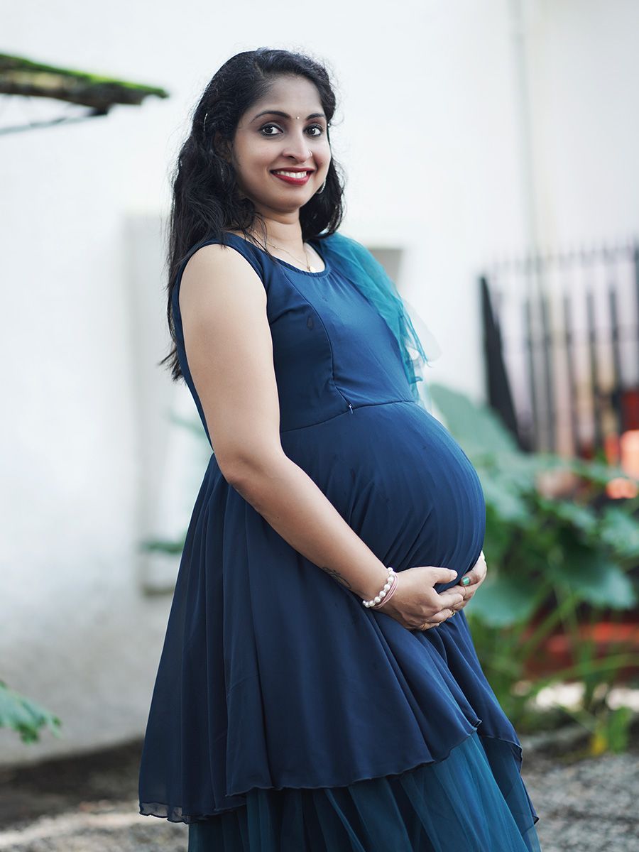 Maternity Photoshoot Shown Blue Gown