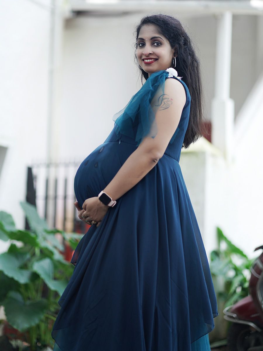 Maternity Photoshoot Shown Blue Gown
