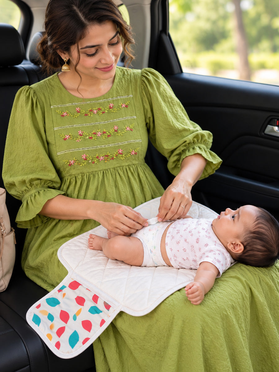 Ziva Baby Nappy & Diaper Changing Sheet – Foldable Travel Changing Mat with Storage Pocket | Off-White Multicolour Leaf Print