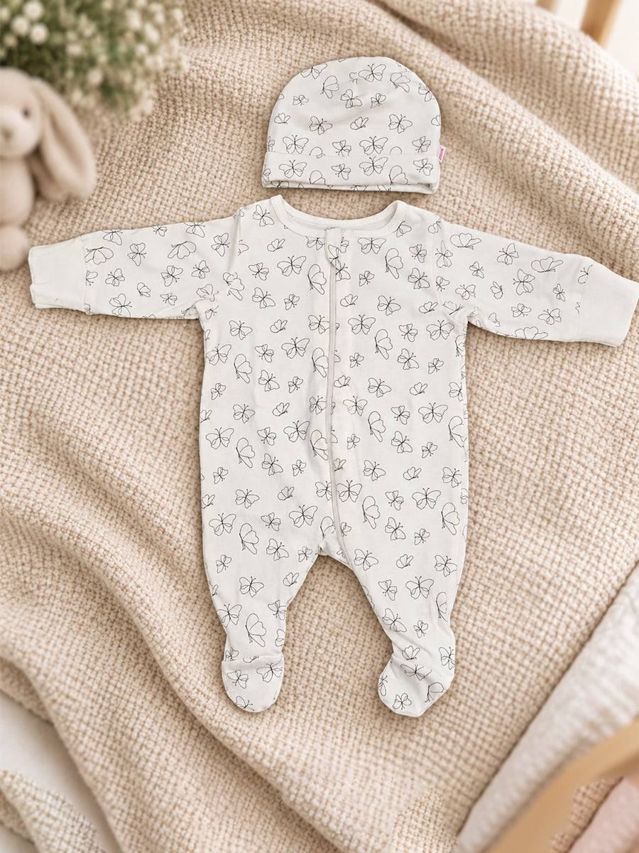 Ziva Baby Sleepsuit with Cap – Off-White Butterfly Print | Premium Knitted Cotton | Front Zip | Fold-Over Mittens & Integrated Booties