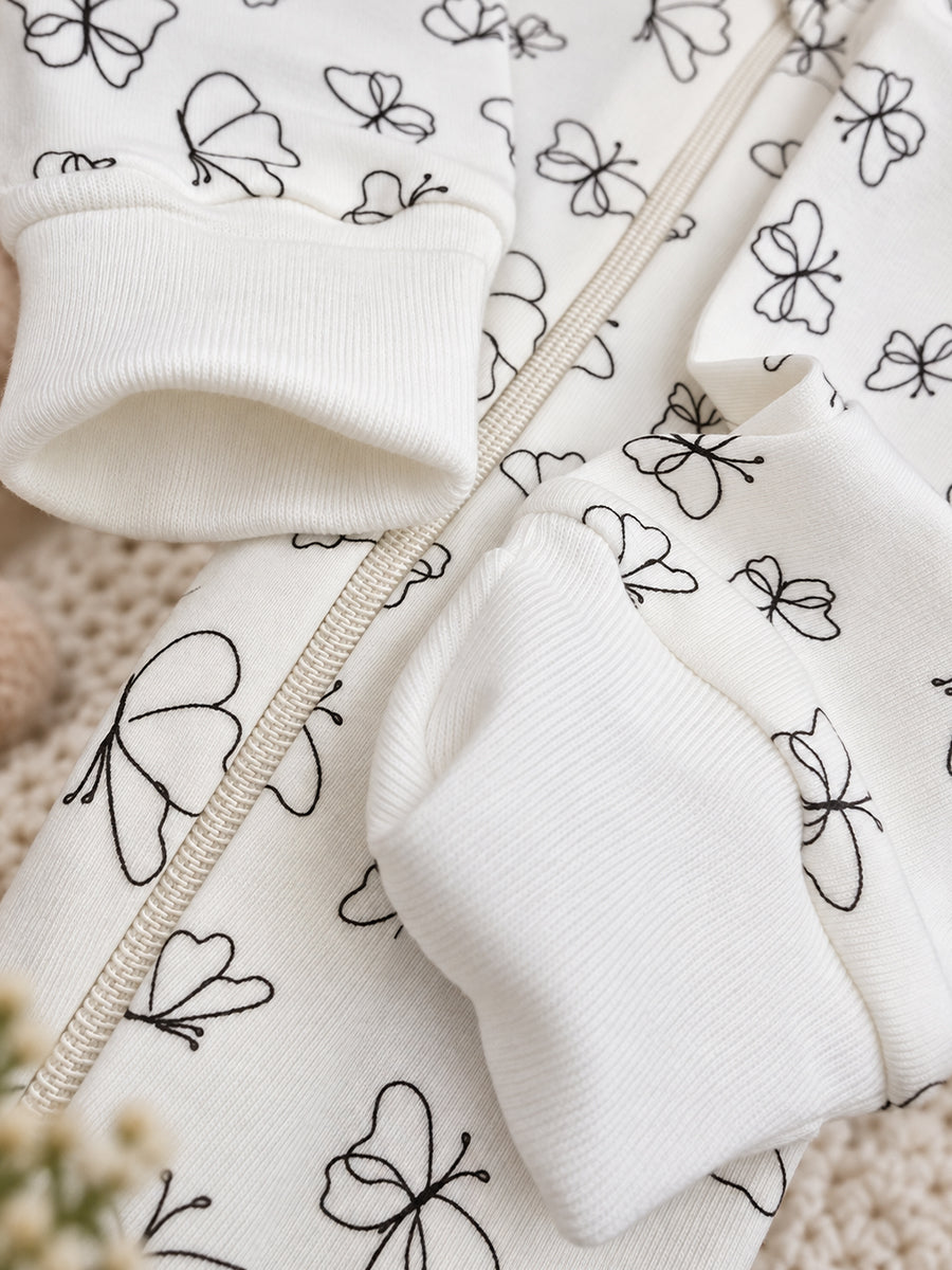 Ziva Baby Sleepsuit with Cap – Off-White Butterfly Print | Premium Knitted Cotton | Front Zip | Fold-Over Mittens & Integrated Booties
