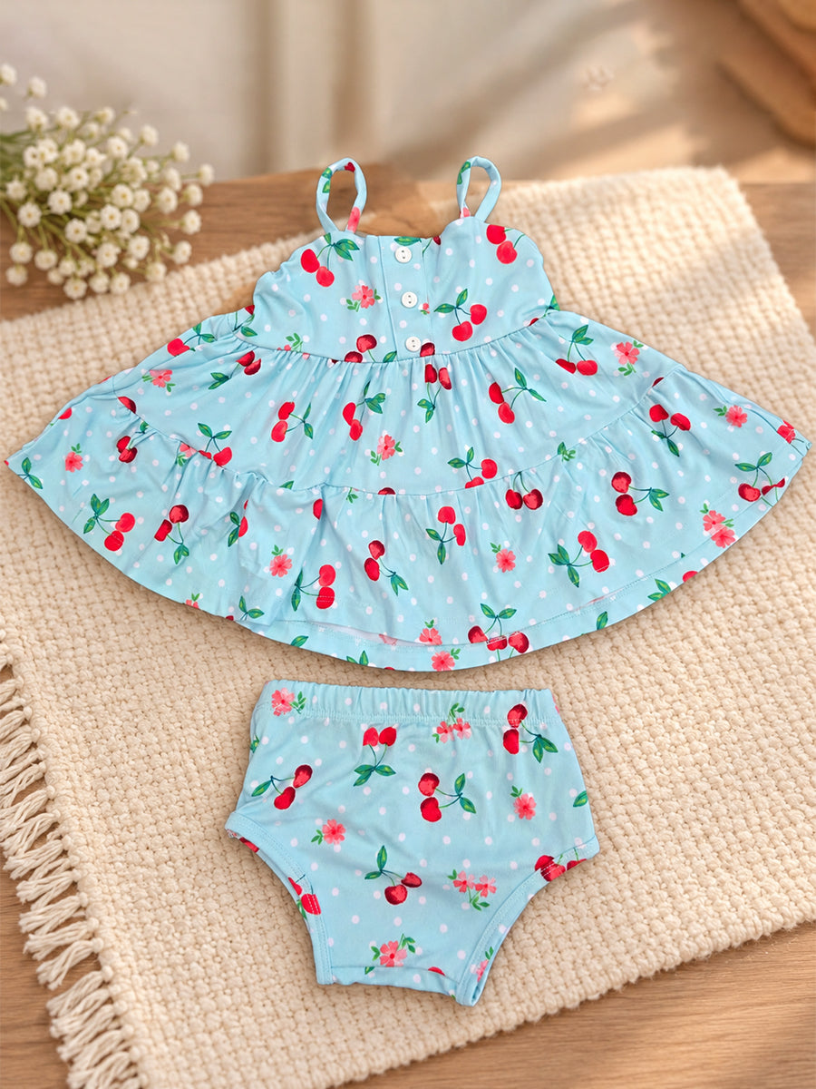 Ziva Baby Girl Strappy Frock with Pantie – Aqua Blue Cherry Print | Premium Knitted Cotton | Layered Frill & Front Buttons | 2-Piece Set