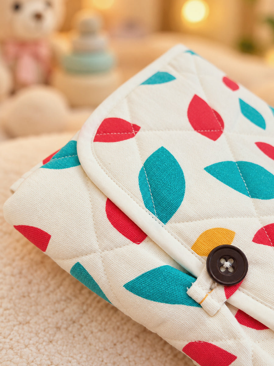 Ziva Baby Nappy & Diaper Changing Sheet – Foldable Travel Changing Mat with Storage Pocket | Off-White Multicolour Leaf Print