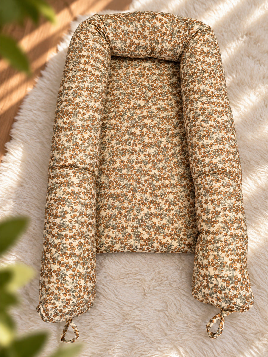 Premium Organic Cotton Multipurpose Baby Nest – Newborn Baby Lounger & Baby Bed | Rust Orange Botanical Fruit Print | Ziva Collected | Carefully Selected for Your Little One